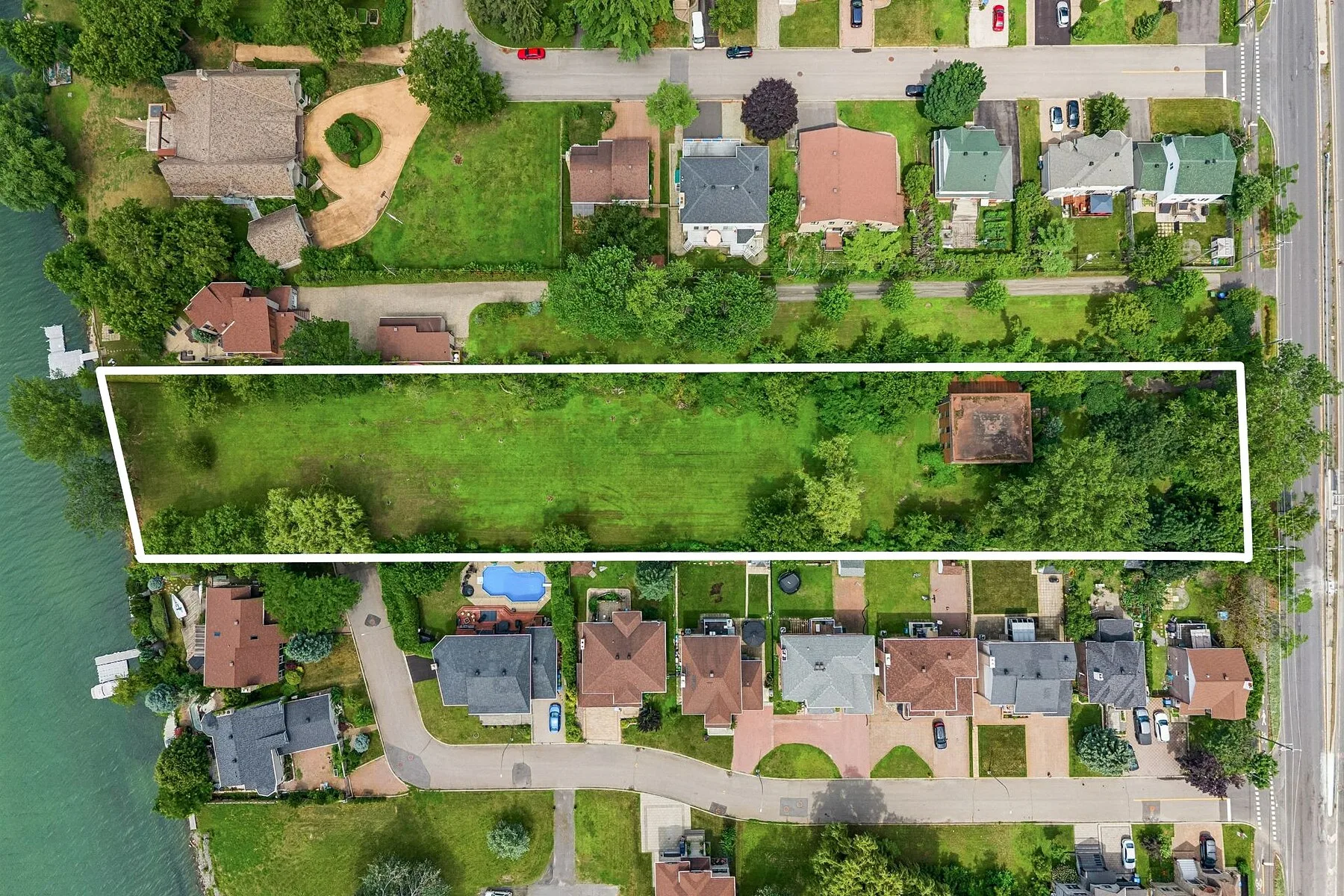 Aerial view of the waterfront grounds at 8810 boulevard Marie-Victorin, Brossard
